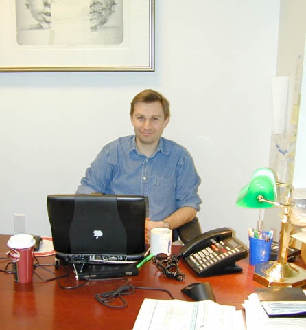 David Sinclair seated at his desk in the early lab office