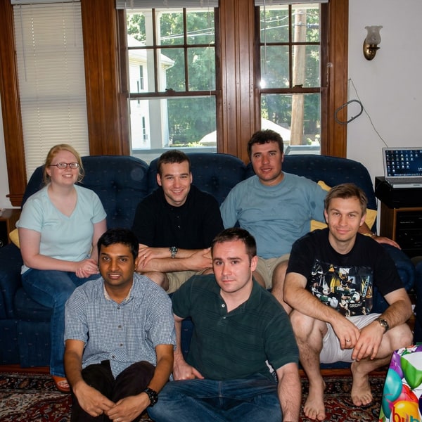 Lab members gathered on and around a couch